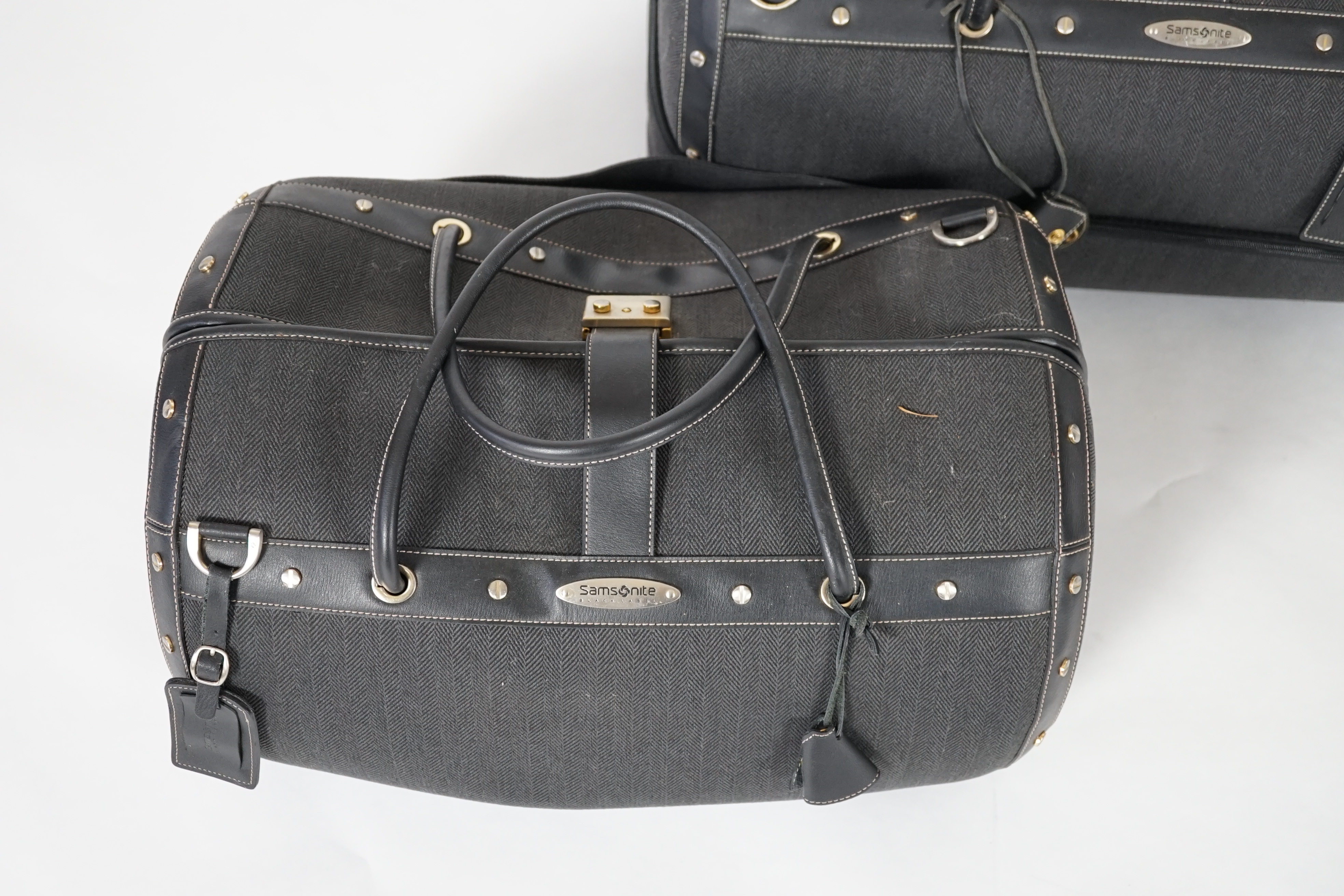 Two Samsonite Black Label charcoal herringbone holdalls, 62cm x 34cm x 40cm and 48cm x 28cm x 34cm